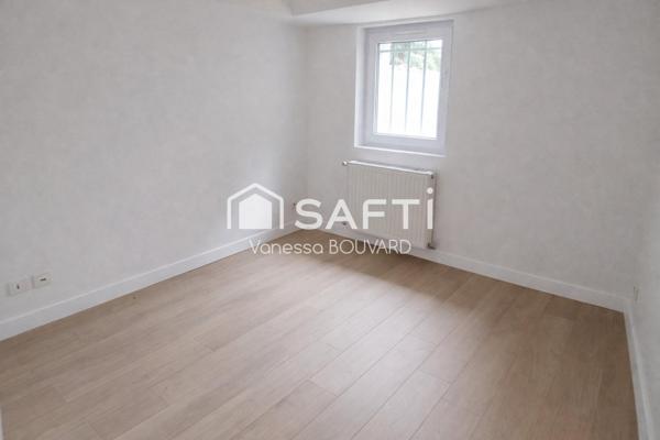 Maison mitoyenne rénovée avec jardin et sous-sol aménagé