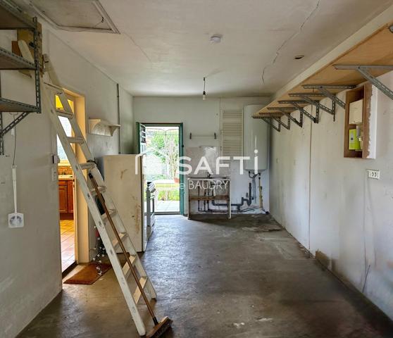 Plain-pied de trois chambres avec jardin et garages