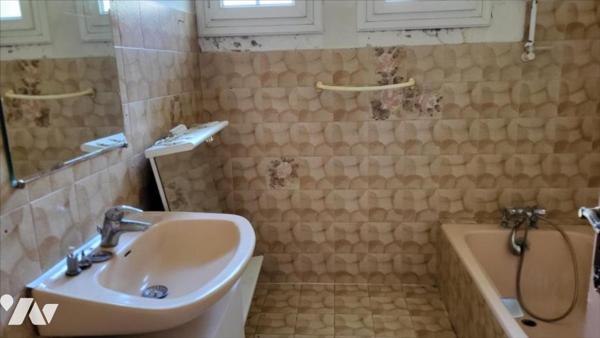 Dans un quartier résidentiel, pavillon sur 1420 m²