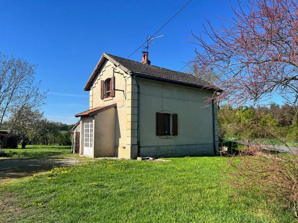 Maison avec terrain + puits + cave
