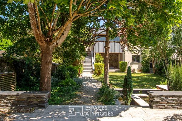 L’élégante demeure de charme et son jardin paysager