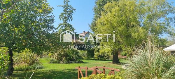 Maison familiale sur un très beau jardin arboré