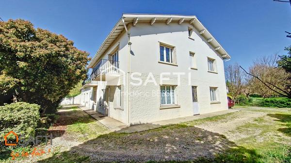 Maison T9 270m² avec garage, dépendance et parc arboré.