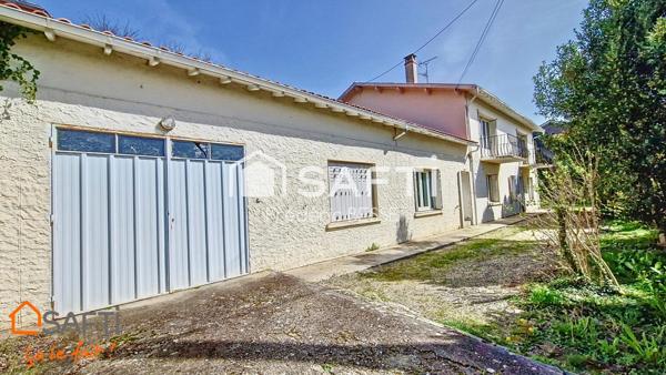 Maison T9 270m² avec garage, dépendance et parc arboré.