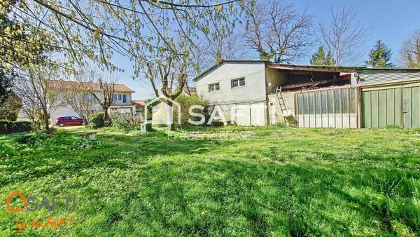 Maison T9 270m² avec garage, dépendance et parc arboré.