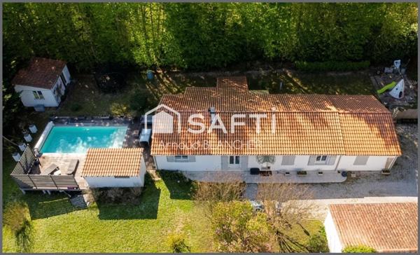 Pavillon plain-pied 5 chambres, 2 salles de bains, grande terrasse et piscine.