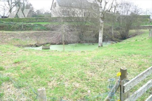 A vendre à Ambrières les vallées(53), sortie de ville, un terrain de 2 451 m² comprenant une ma...