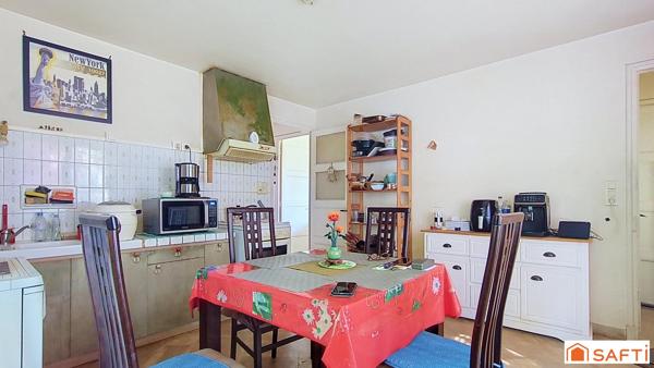Maison avec terrain arboré de 1 180 m² et garage