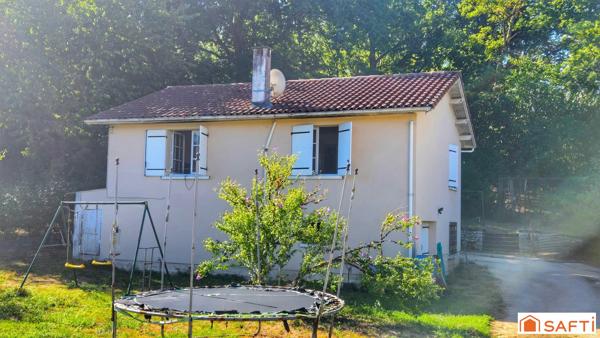 Maison avec terrain arboré de 1 180 m² et garage