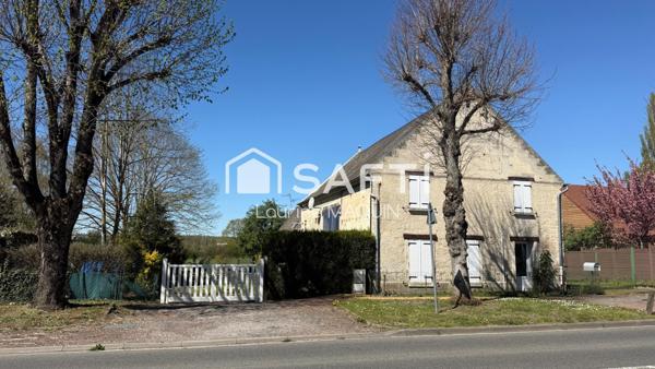 Maison en pierre disposant d'une grange attenante