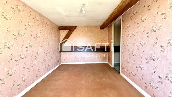 Maison en pierre disposant d'une grange attenante