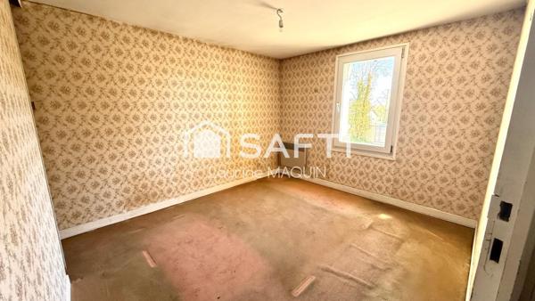 Maison en pierre disposant d'une grange attenante