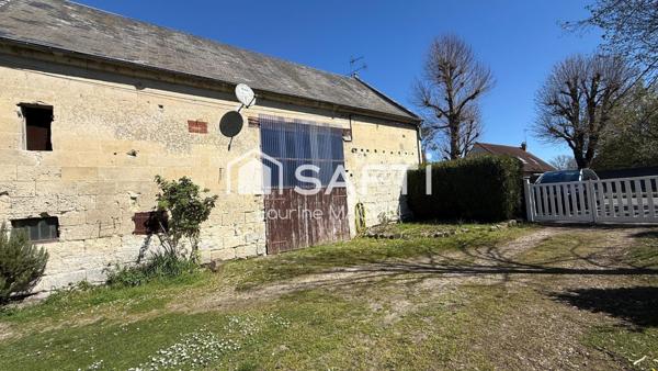 Maison en pierre disposant d'une grange attenante