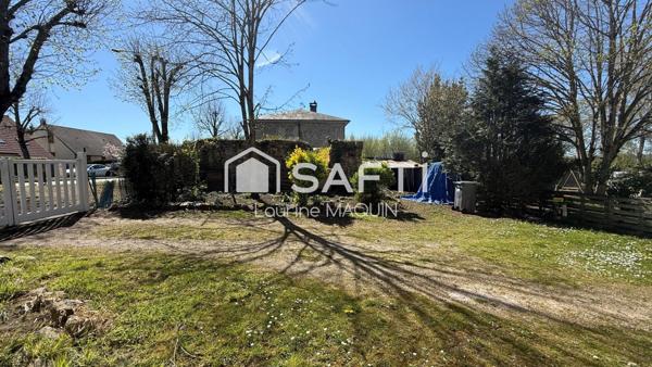 Maison en pierre disposant d'une grange attenante
