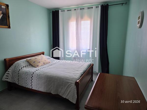 Maison familiale avec 4 chambres, garage 70 m² et jardin constructible