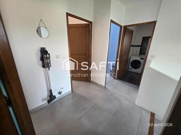 Maison familiale avec 4 chambres, garage 70 m² et jardin constructible