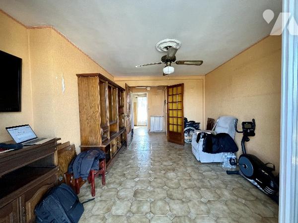 Appartement T3 traversant de 56m² avec deux balcons, stationnement dans résidence