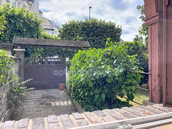 Maison de caractère avec jardin arboré -