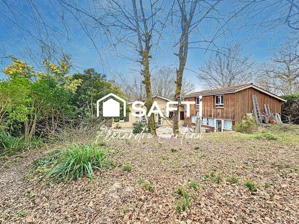 Maison 4 chambres, grand atelier, grande parcelle boisée.