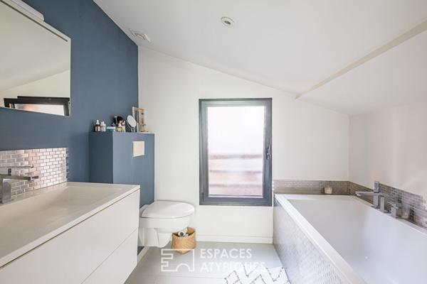 Loft en rez-de-chaussée avec terrasse et grand garage