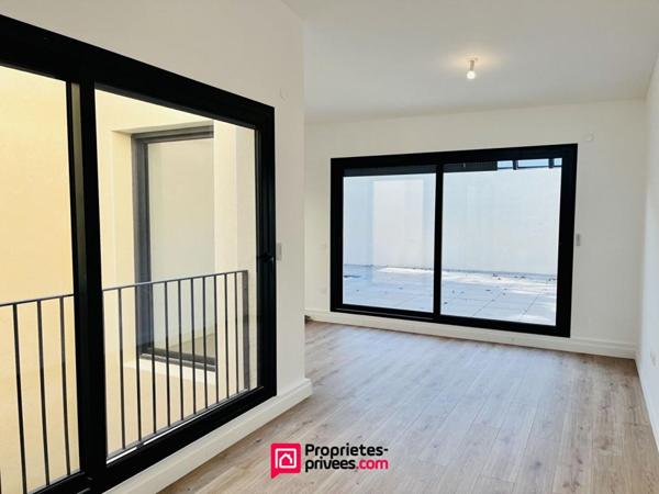 Loft industriel T4 neuf 182m², terrasse 46m², piscine, centre-ville