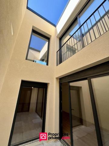 Loft industriel T4 neuf 182m², terrasse 46m², piscine, centre-ville