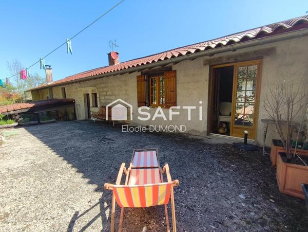 Très belle maison en pierre d'une surface habitable de 174 m2 avec terrain arboré de 2060 m2