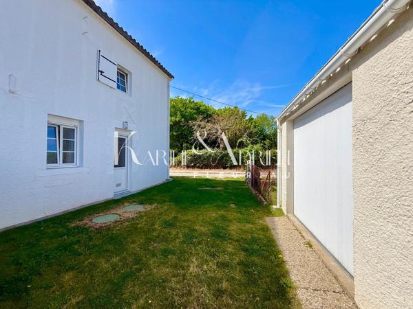 Maison 2 chambres, véranda, garage et jardin