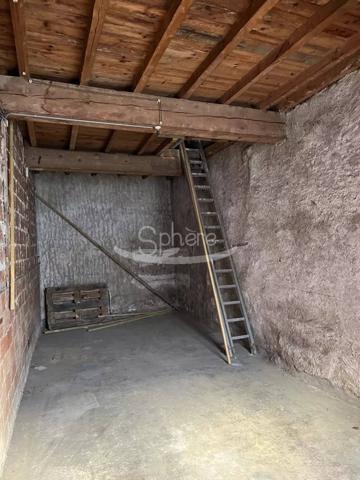 garage avec  pièce sur le dessus