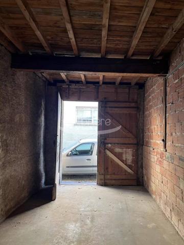 garage avec  pièce sur le dessus