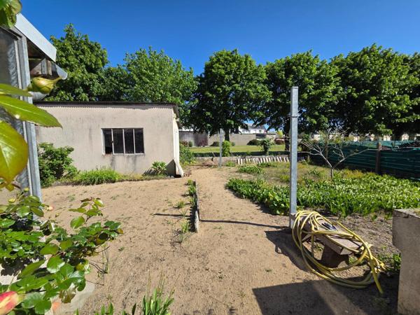 Jolie maison de plain pied proche du centre.