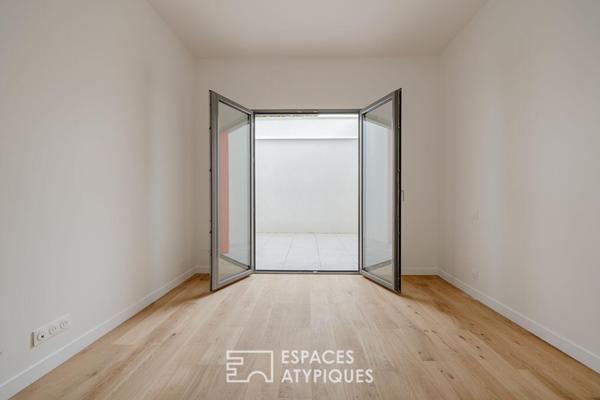 Rénovation de prestige sous verrière aux accents fifties