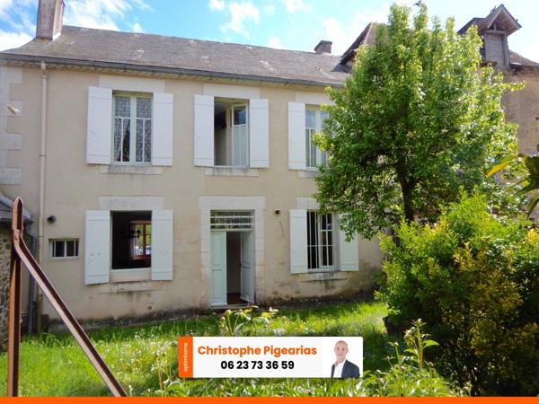 Maison de village en pierre de 6 pièces avec garage.