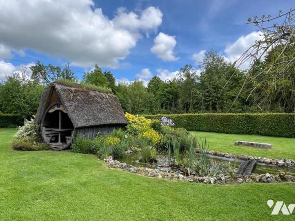 Entre Orbec et Livarot belle propriété composée de plusieurs maisons bel environnement
