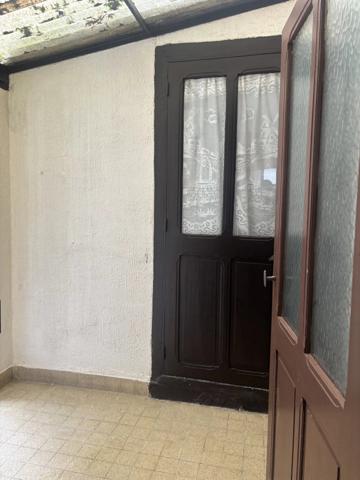 Maison ancienne divisée en 4 appartements