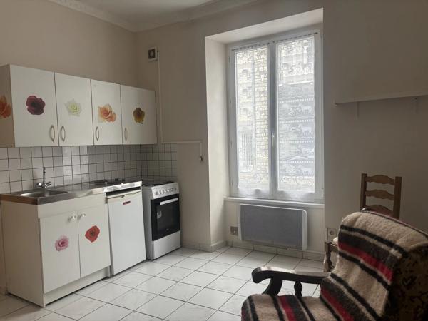 Maison ancienne divisée en 4 appartements