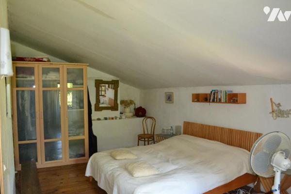 BATISSE EN PIERRE AVEC TERRAIN ATTENANT DE 8806 m²