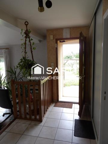 Maison familiale avec double garage et jardin au calme