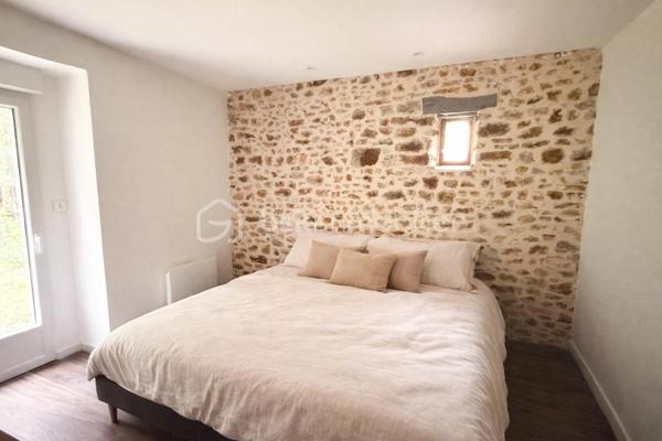 Vous recherchez une maison avec de la pierre, du bois, de la verdure et du calme... une maison vous offrant un beau potentiel, avec quelques travaux de finitions afin de la mettre à votre goût ? J'ai peut-être ça, lisez la suite !
Dès votre arrivée dans le chemin, vous pourrez succomber au charme de cette maison en pierre avec son extension bois....
Nous commencerons la visite par une vaste entrée, elle distribue la pièce de vie lumineuse de 40m2 avec sa grande baie donnant accès direct au jardin,  elle comprend le salon-séjour et la cuisine aménagée et équipée récente. La pièce de vie est une extension bois qui a été construite en 2020.  Nous poursuivrons avec un espace buanderie de 6m2, un wc séparé, et une suite parentale de 21m2 avec un espace chambre, un dressing et une salle d'eau privative. 
Direction ensuite l'étage, une vaste mezzanine de 20m2 pouvant aisément accueillir un espace bureau, une salle de jeux distribue une salle de bain de 6m2, un wc séparé, une chambre de 9m2 et deux autres chambres de 13m2 au sol. Le mode de chauffage est électrique. Plusieurs menuiseries ont été changées en pvc double vitrage, la grande baie du salon en double vitrage sera à envisager. La taxe foncière est de 640€. 
Allons à l'extérieur, entourée de végétation, vous pourrez profiter en toute tranquillité, sans aucun vis à vis, de la parcelle de 3200m2. Non attenant à la maison un atelier vous y attend pour y mettre voitures, motos, bricolage etc... . Vous souhaiteriez pouvoir stationner votre voiture à toute proximité de l'entrée de votre maison ? Pas de soucis, vous pourrez aisément créer un carport sur un des cotés de la maison. Un puits, non raccordé à la maison, est présent. 
Alors ce bien semble correspondre à vos critères de recherche ? Ne tardez pas, appelez-moi !