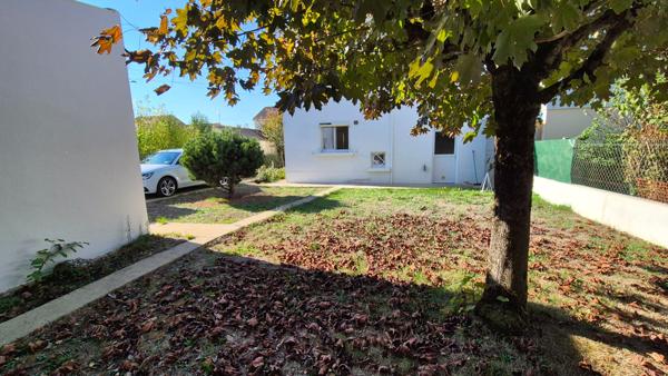 Maison à étage avec jardin clos et garage