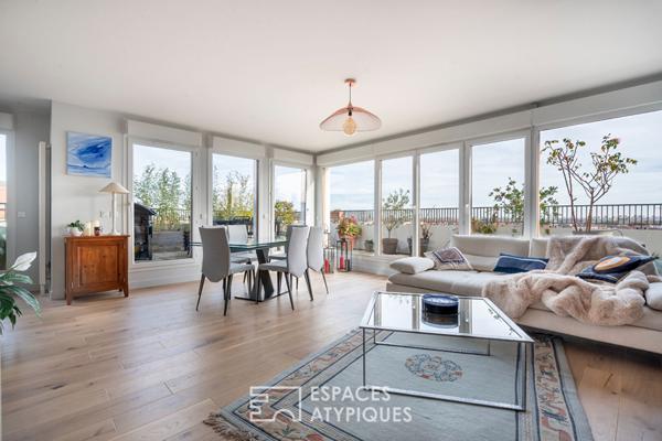 Appartement en dernier étage avec terrasse face à la Seine