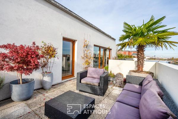 Appartement en dernier étage avec terrasse face à la Seine