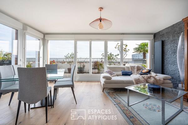 Appartement en dernier étage avec terrasse face à la Seine