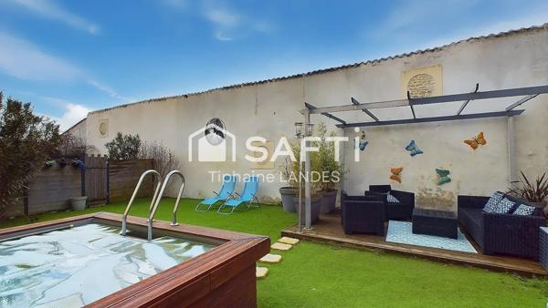 Ensemble immobilier rénové avec piscine.