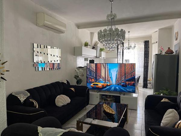 A vendre maison mitoyenne  3 pièces de  65 m2 avec grand garage sur terrain de 295 m2