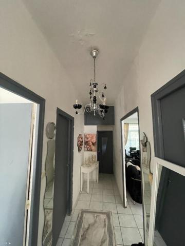 A vendre maison mitoyenne  3 pièces de  65 m2 avec grand garage sur terrain de 295 m2