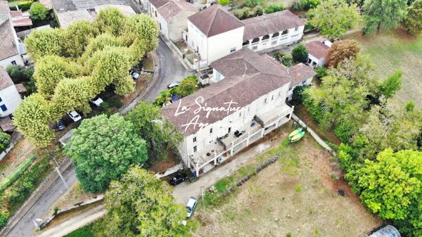 Ensemble Immobilier de 953 m2 avec parc arboré de 6598 m2 au bord de la Baïse – Lavardac centre