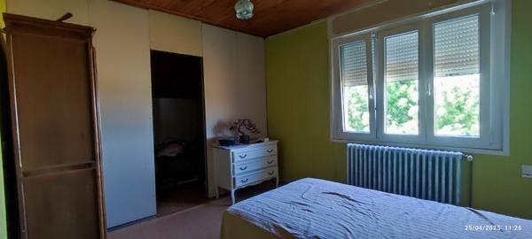 Maison de caractère avec 6 chambres, 2 garages et fort potentiel