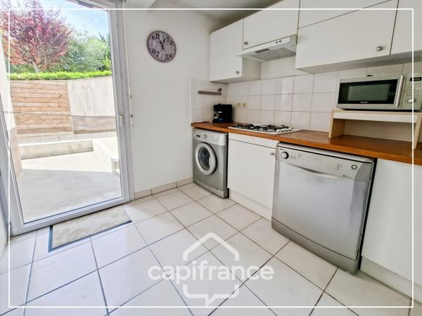 Appartement climatisé 3 pièces avec jardin, parking, cave et piscine commune