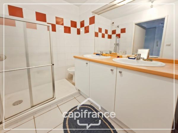 Appartement climatisé 3 pièces avec jardin, parking, cave et piscine commune